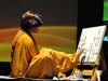 Sheela painting as the music enthralls the audience