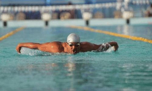 Mohammed Shams Alam Sheikh, para-athlete, swimming during a competition.